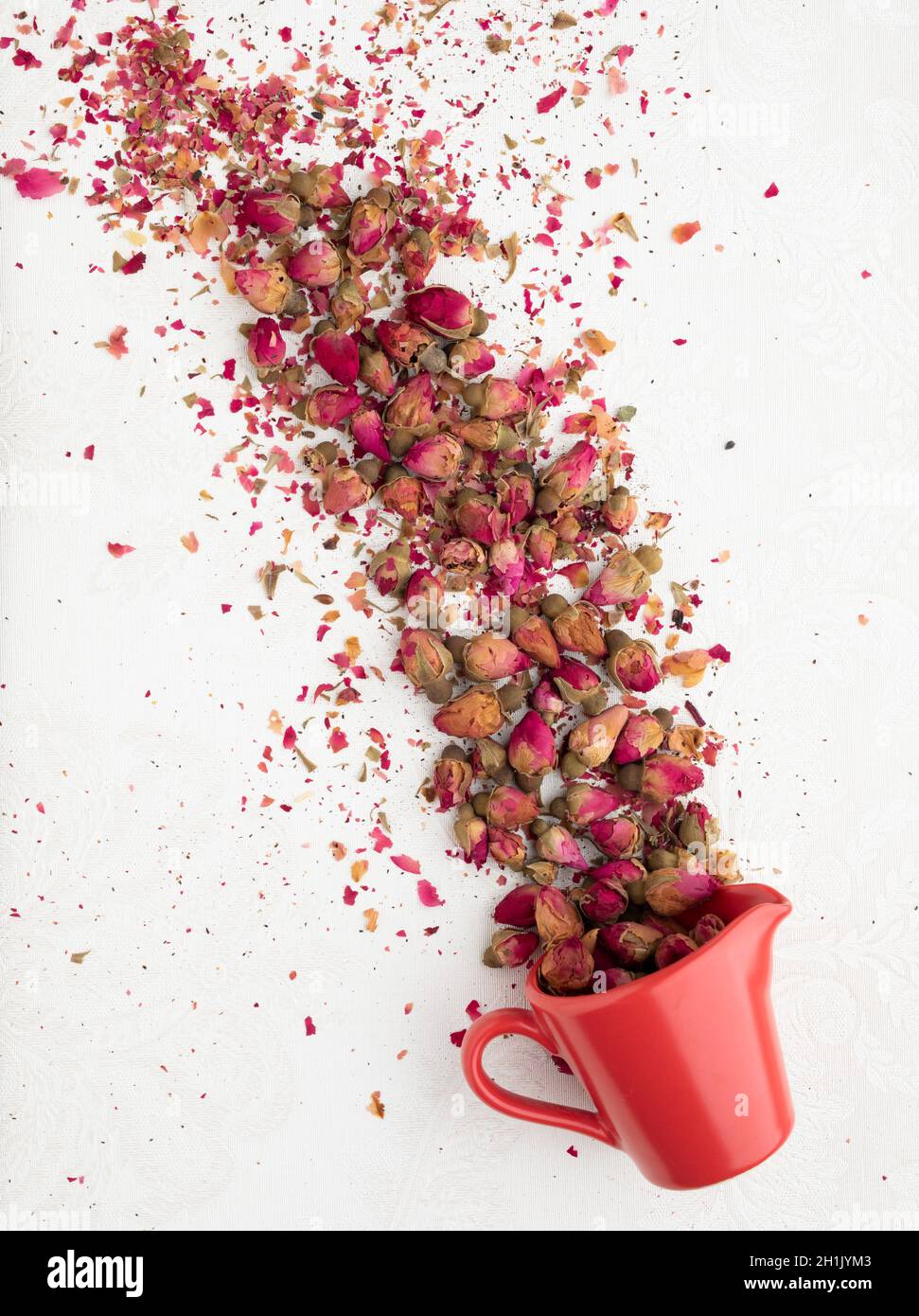A cup of small red Mohammedan roses Stock Photo