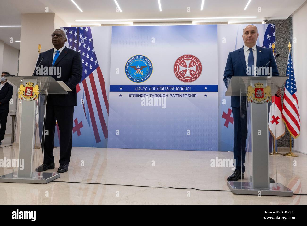 Tbilisi, Georgia. 18th Oct, 2021. U.S. Secretary of Defense Lloyd J. Austin III, listens to a question during a joint press conference with Georgian Minister of Defense Juansher Burchuladze, right, at the Georgian Ministry of Defense October 18, 2021 in Tbilisi, Georgia. Austin is in Tbilisi to reaffirm U.S. support for sovereignty and territorial integrity. Credit: Chad McNeeley/DOD/Alamy Live News Stock Photo