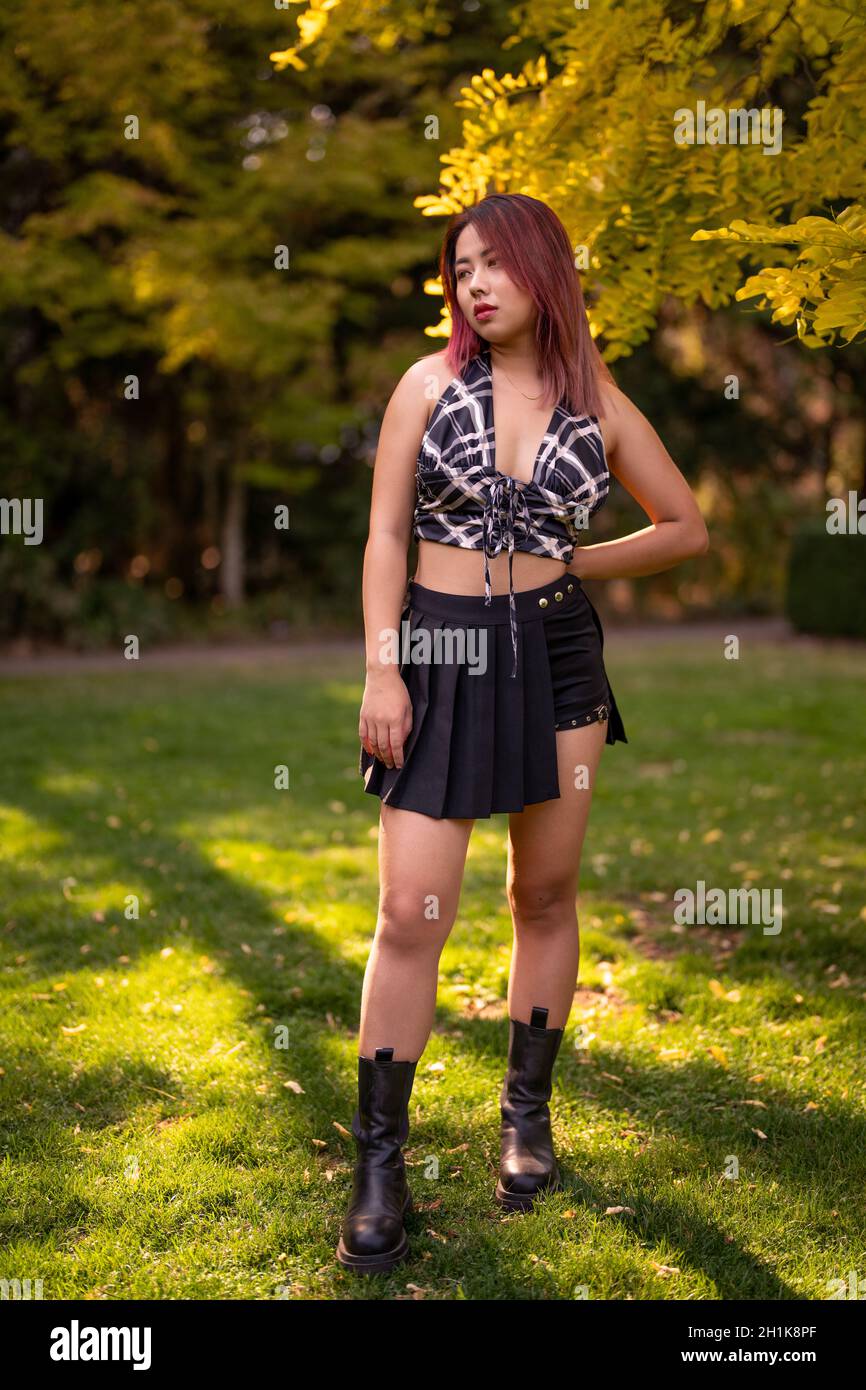 Young Edgy Asian Woman in a Garden Stock Photo