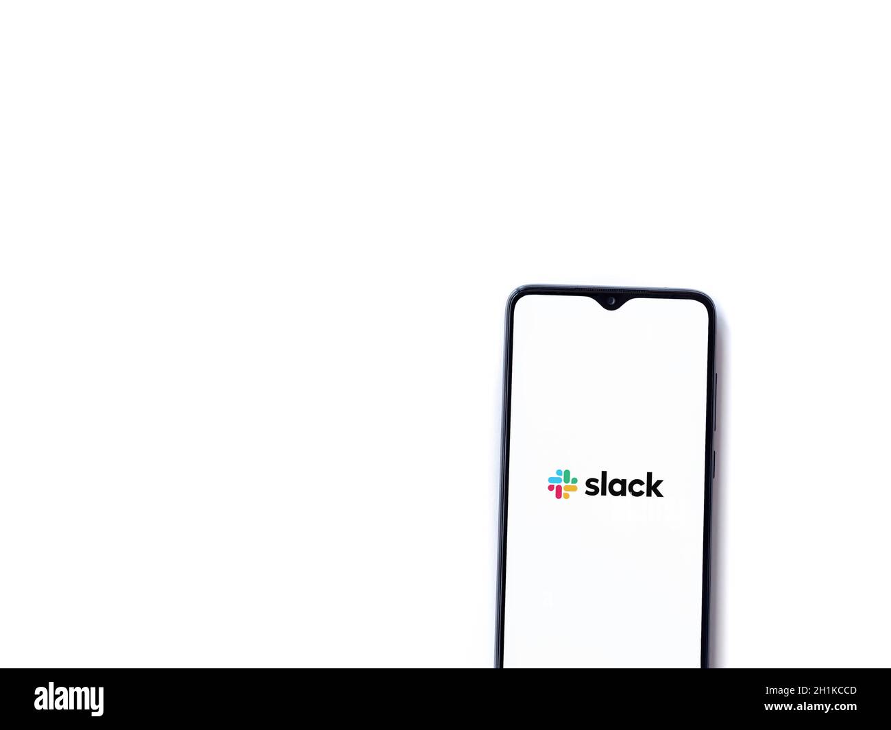 Lod, Israel - July 8, 2020: Slack app launch screen with logo on the display of a black mobile smartphone isolated on white background. Top view flat Stock Photo