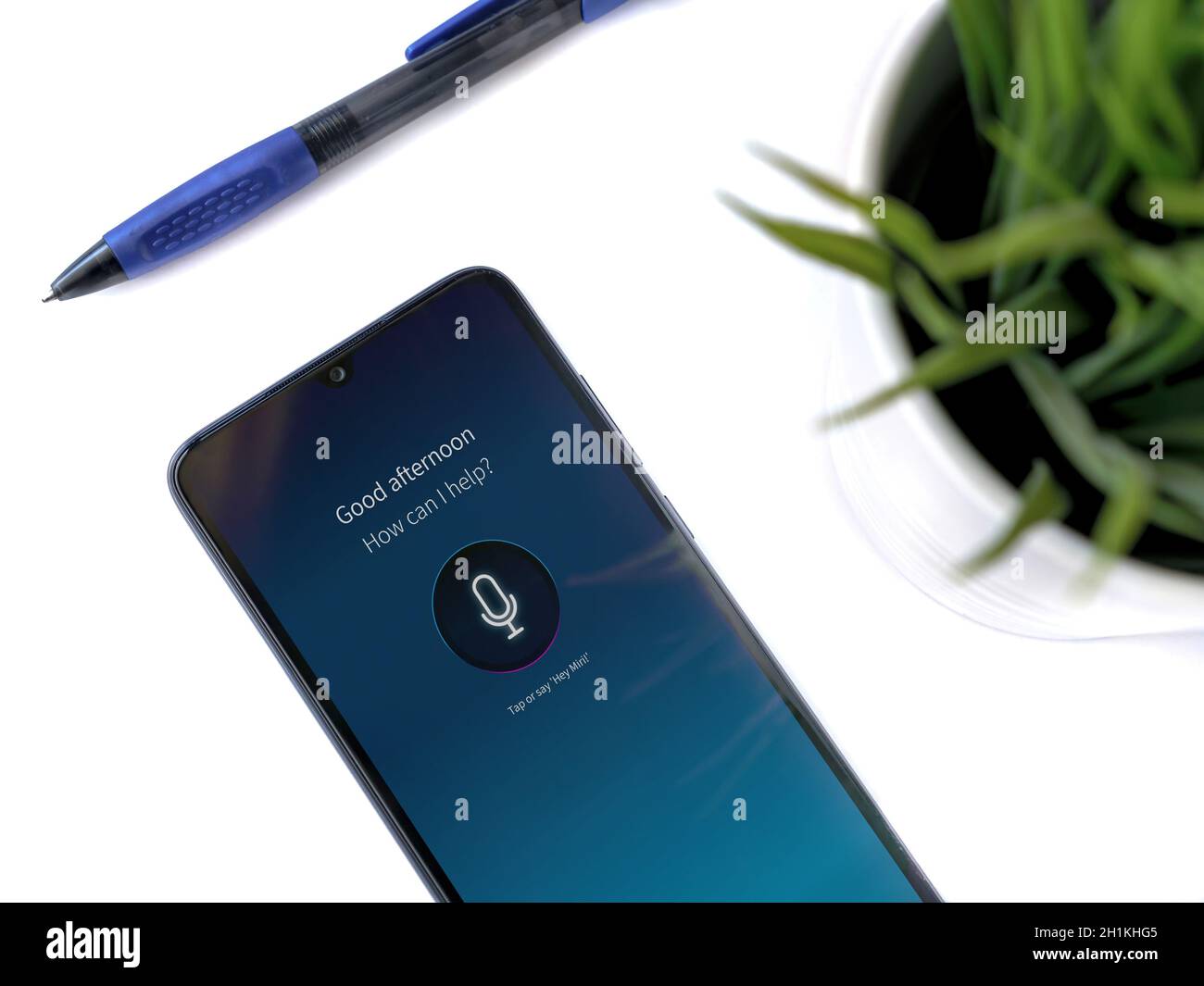Lod, Israel - July 8, 2020: Modern minimalist office workspace with black mobile smartphone with Miri app launch screen with logo on white background. Stock Photo
