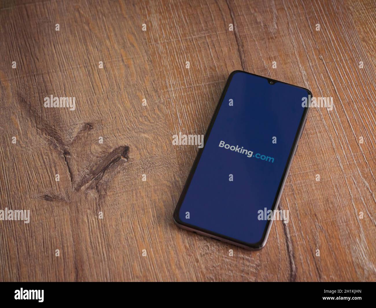 Lod Israel July 8 2020 Booking Com App Launch Screen With Logo On The Display Of A Black Mobile Smartphone On Wooden Background Top View Flat La Stock Photo Alamy