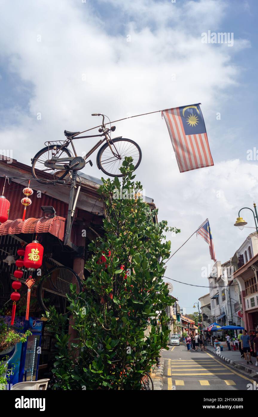 Malaysia flag decorated at bicycle hang at rooftop. Stock Photo