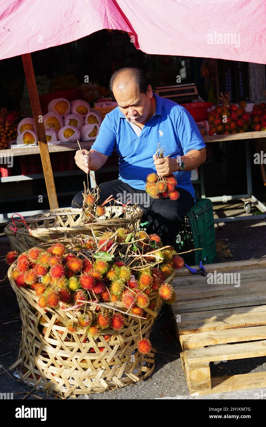Bukit Mertajam, Penang/Malaysia - Sep 04 2016: Seller sell the rambutan ...