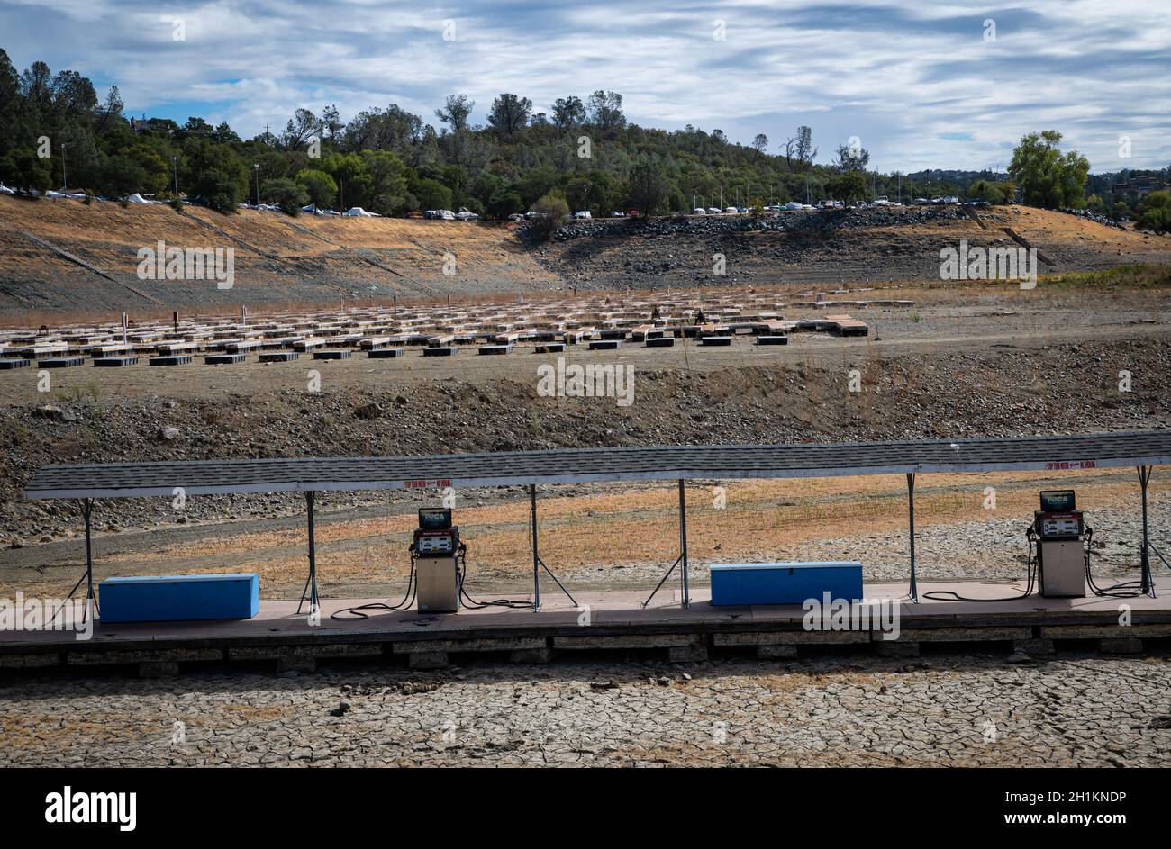Two gas pump with empty docks at Brown's Ravine marina at Folsom Lake. Water levels are at historic lows due to lack of rain and hot weather. Stock Photo
