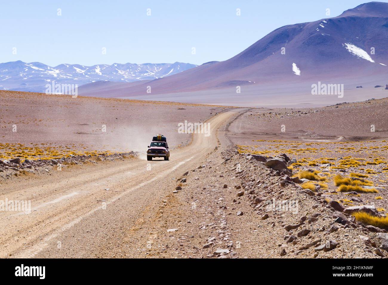 Bolivian dirt road perspective view,Bolivia. Salvador Dali Desert Stock Photo