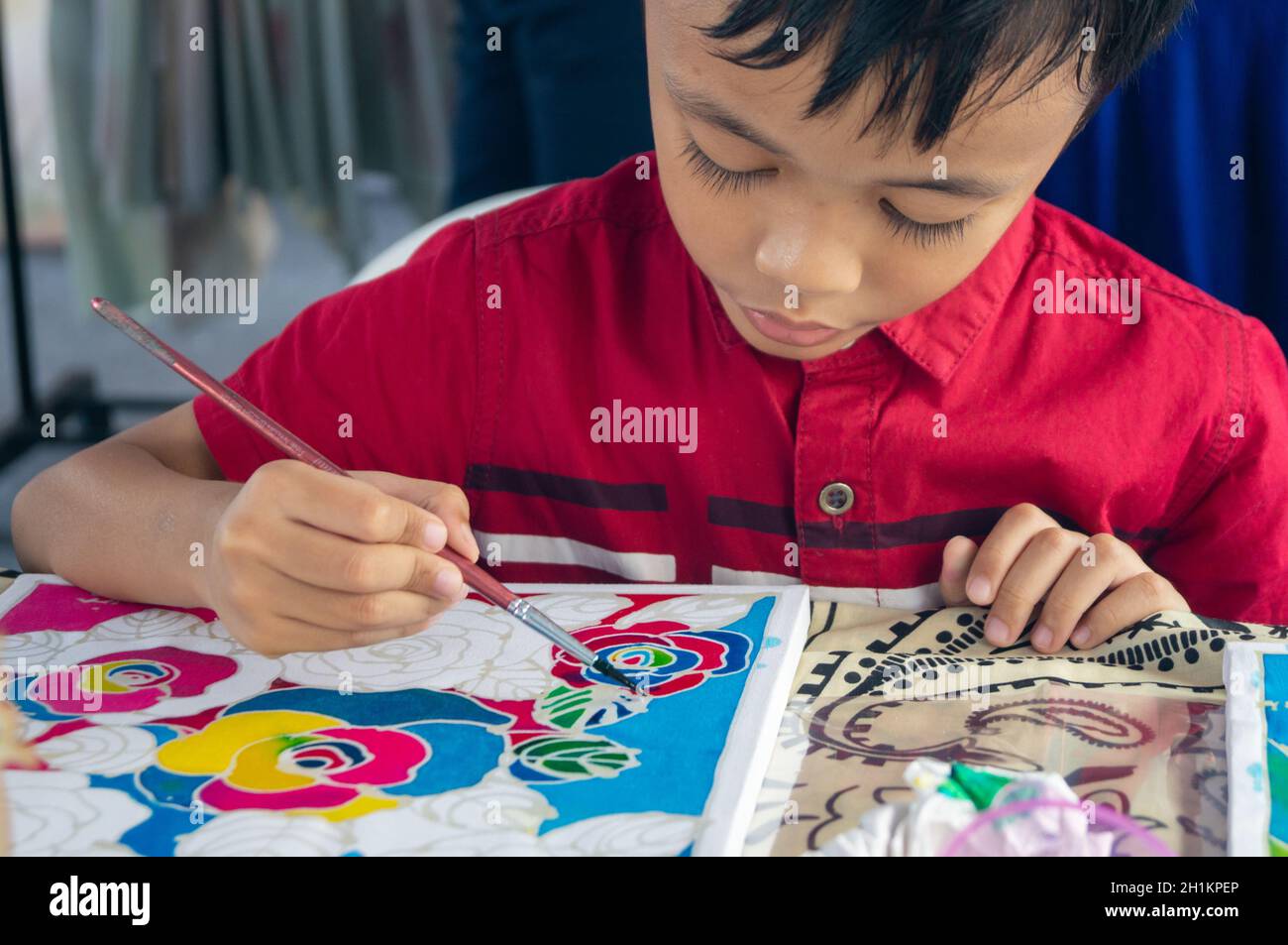 Georgetown, Penang/Malaysia - Feb 15 2020: A kid color the batik drawing. Stock Photo