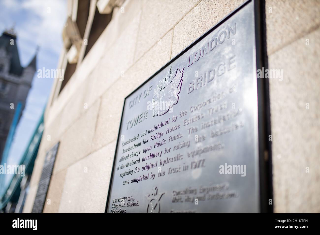 London, UK - September 30, 2020: Landscape view of the Tower Bridge -inaugurated in 1894- commemorative plaque with its history written on it, and wit Stock Photo