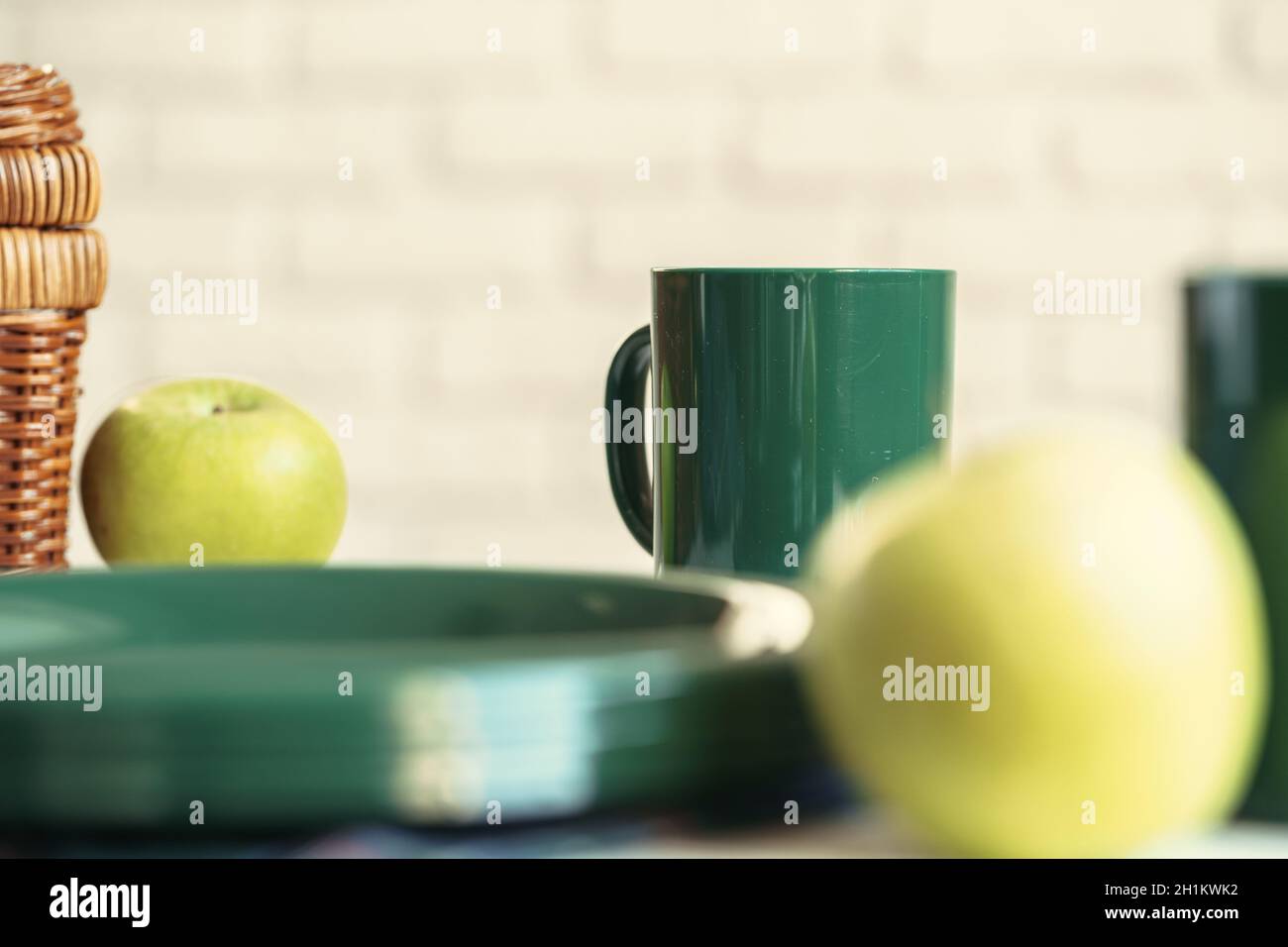 Green plastic kitchenware on a table close up Stock Photo