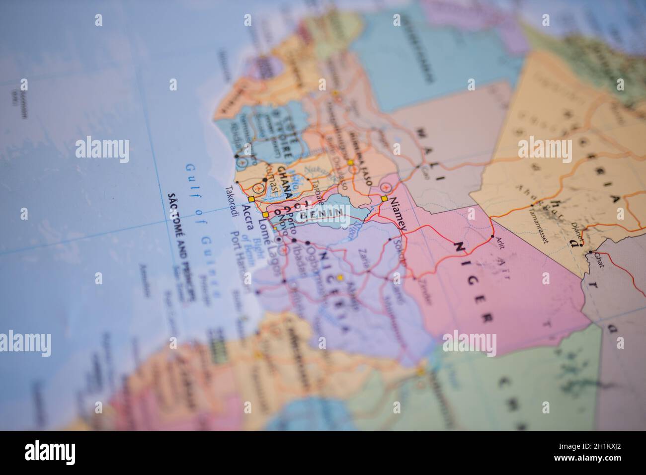 Benin on a map of Western Africa with its main roads marked in red and the rest of the countries blurred out Stock Photo