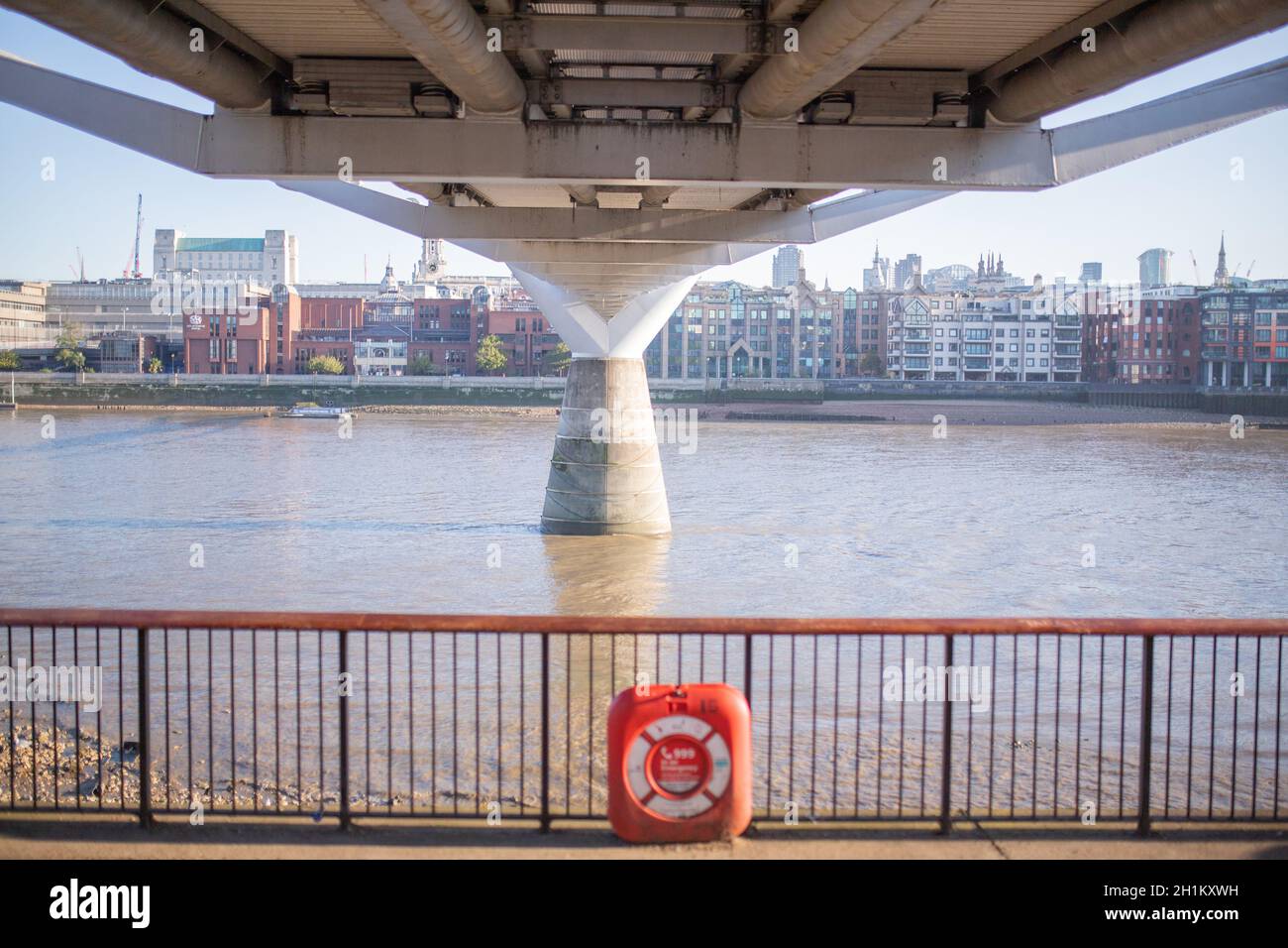 London, UK - September 1, 2020: Landscape View of Orange Emergency Floatation Device Along the Thames Path in the UK Stock Photo