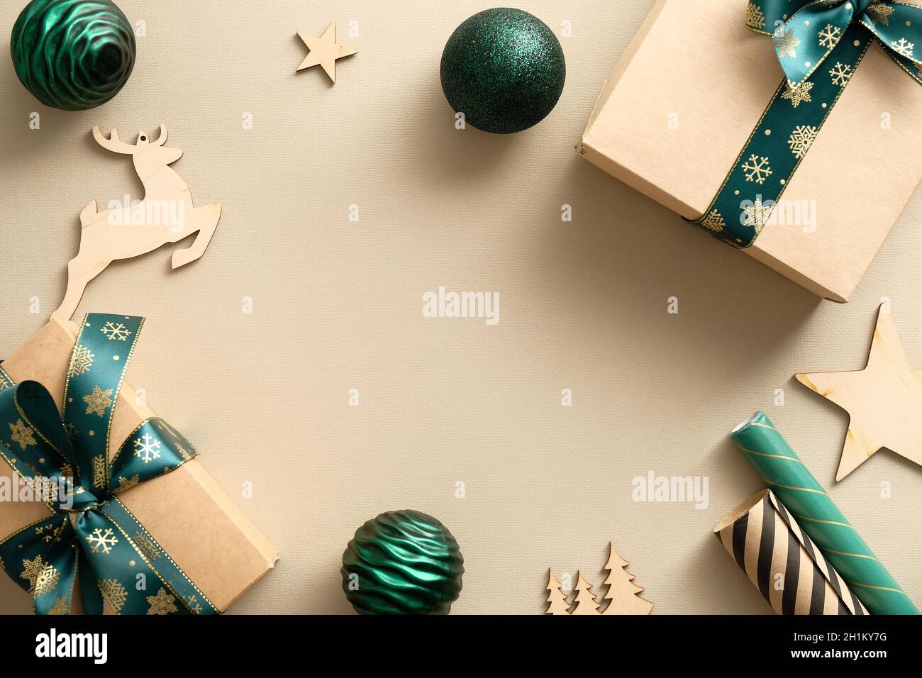 Christmas composition with elegant gift boxes wrapped craft paper with ...