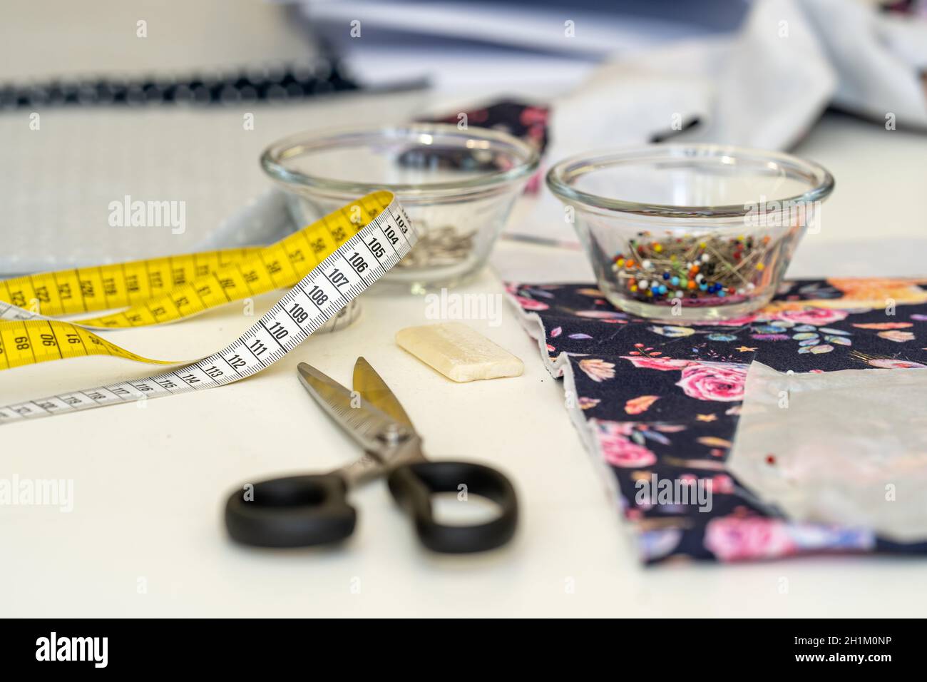 tailor's tape measure on a sewing table in a tailor shop Stock Photo