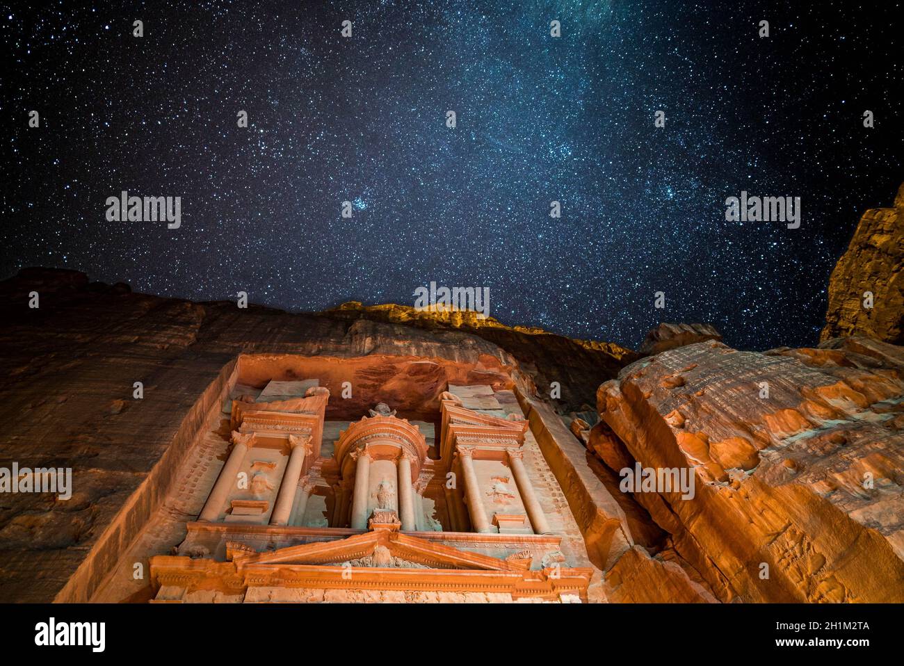 Petra treasury by night lighten by candles and galaxy Stock Photo
