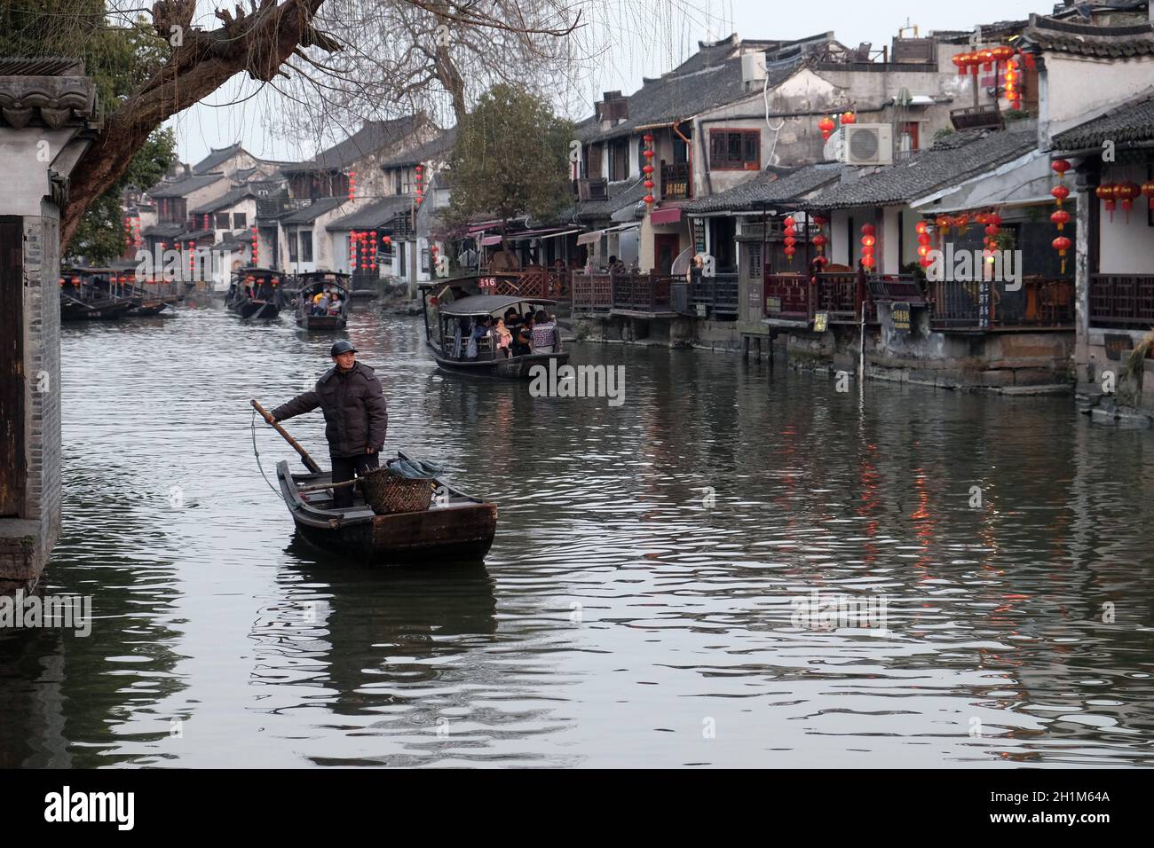 Tourist boats on the water canals of Xitang Town in Zhejiang Province, China Stock Photo