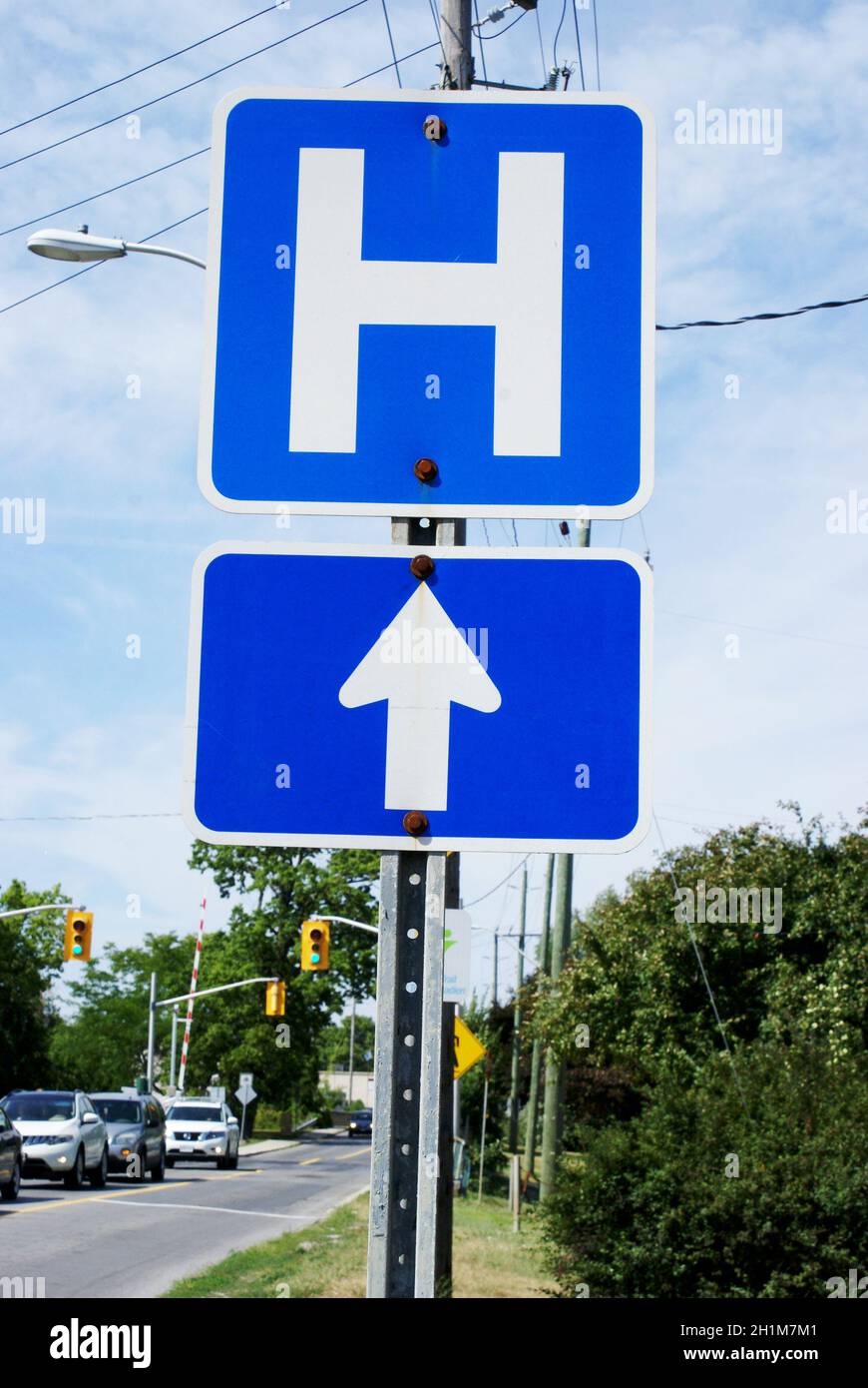 A Canadian hospital direction street sign used in traffic law and order. Stock Photo