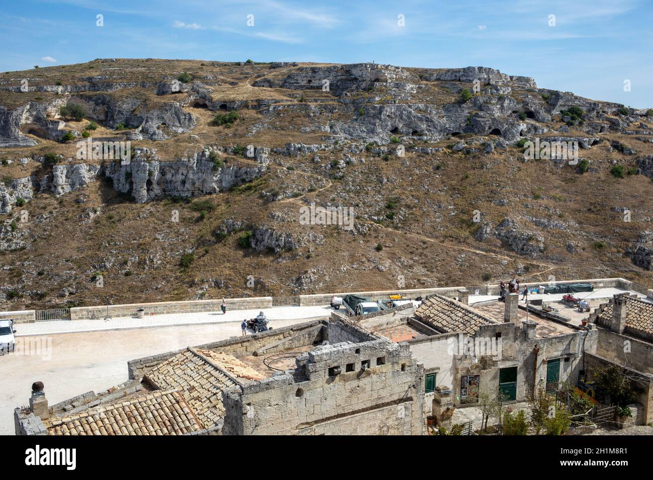 Matera, Italy - September 15, 2019: View of Gravina river canyon and park of the Rupestrian Churches of Matera with houses in caves di Murgia Timone n Stock Photo