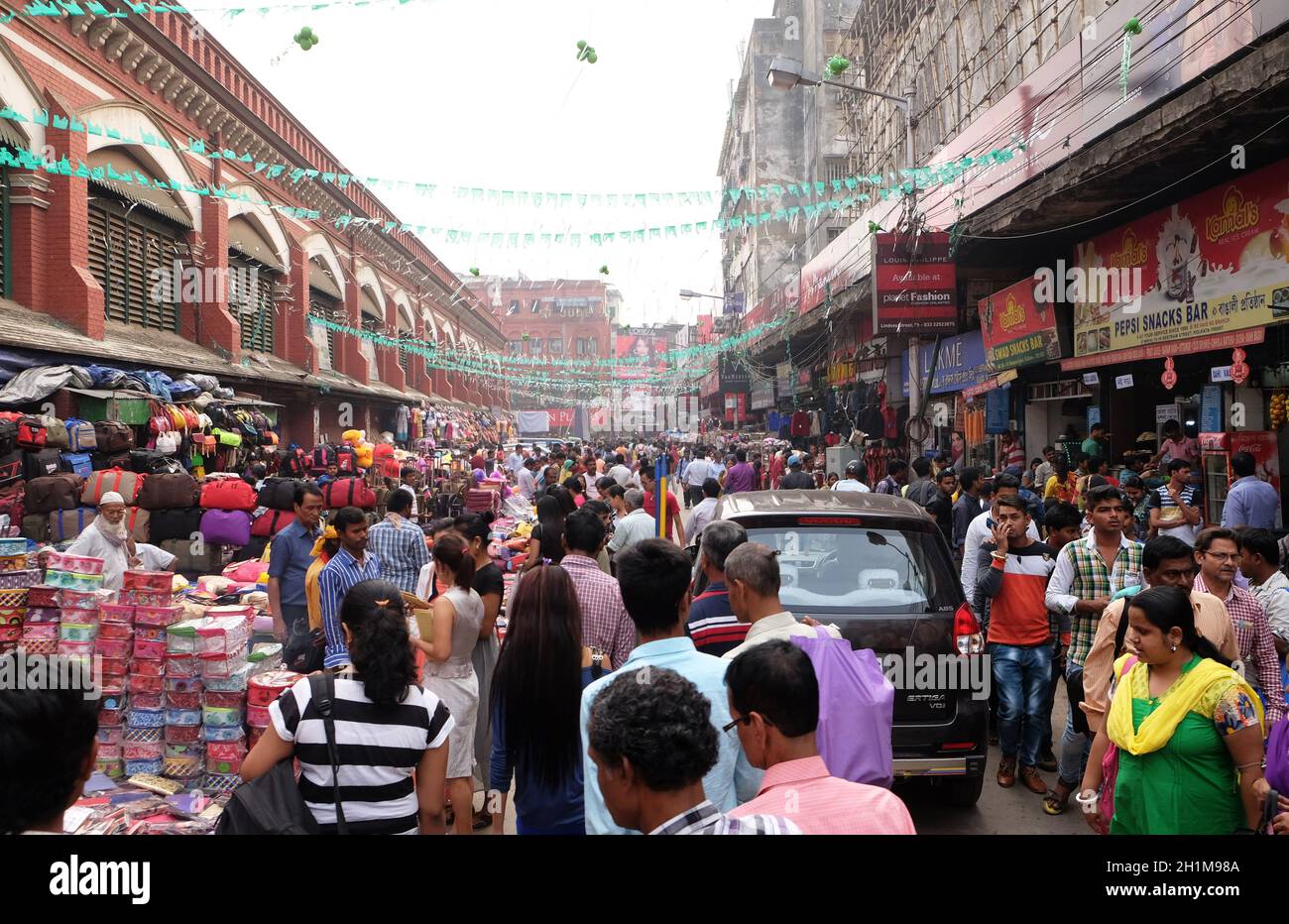 Crowded pedestrian shopping area near New Market in Kolkata, India