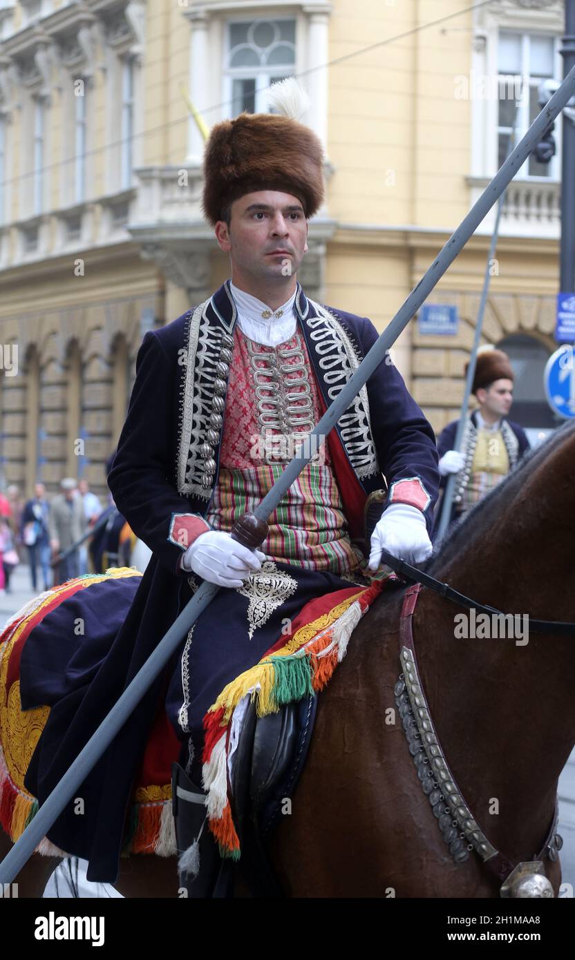 Parade of 70 participants, thirty horses and forty members of a brass band to the main square were announced next, 300th Sinjska alka in Zagreb Stock Photo