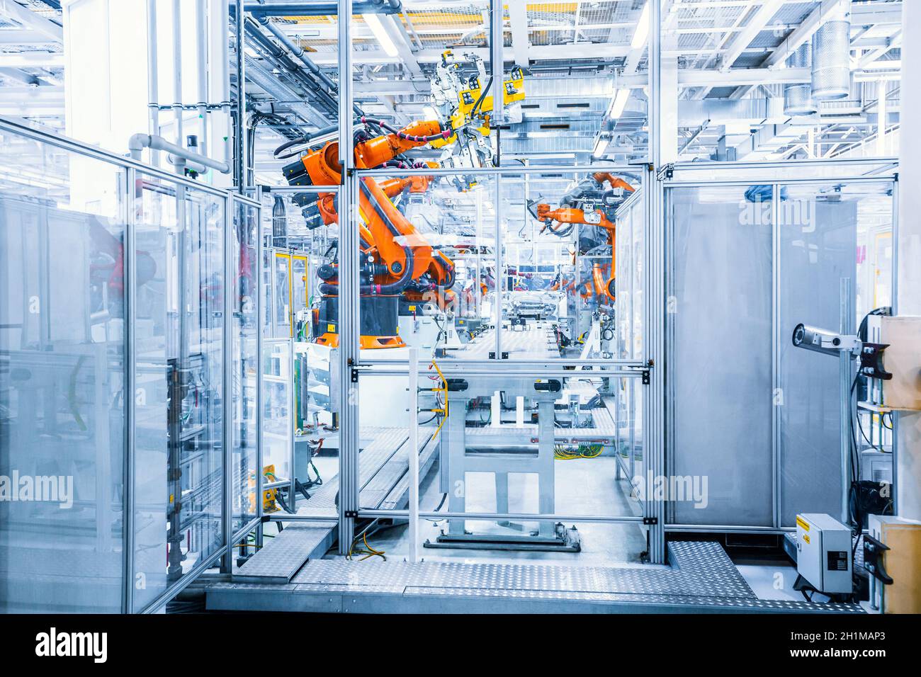 robotic arms in a car plant Stock Photo