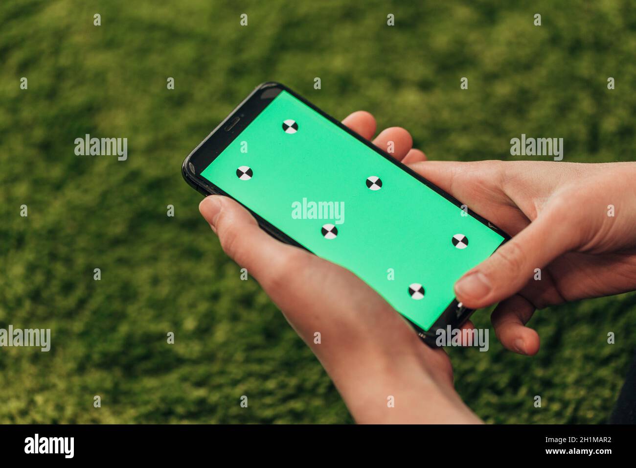 Girl Holds An New Smart Phone In Her Hand. Stock Photo