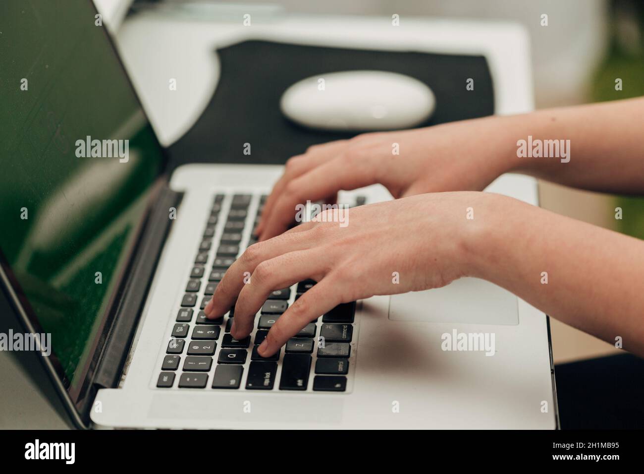 Close-Up Shot of Human Hands Placed Over Laptop. Stock Photo