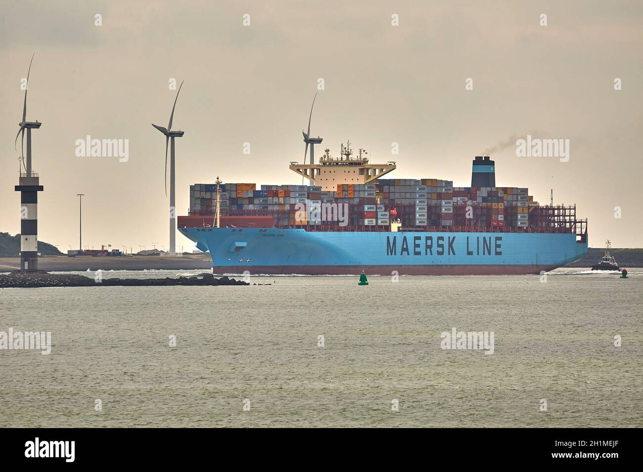 ROTTERDAM, THE NETHERLANDS - CIRCA 2019: Maersk container ship entering the Port of Rotterdam. It's the busiest cargo prot of Europe Stock Photo