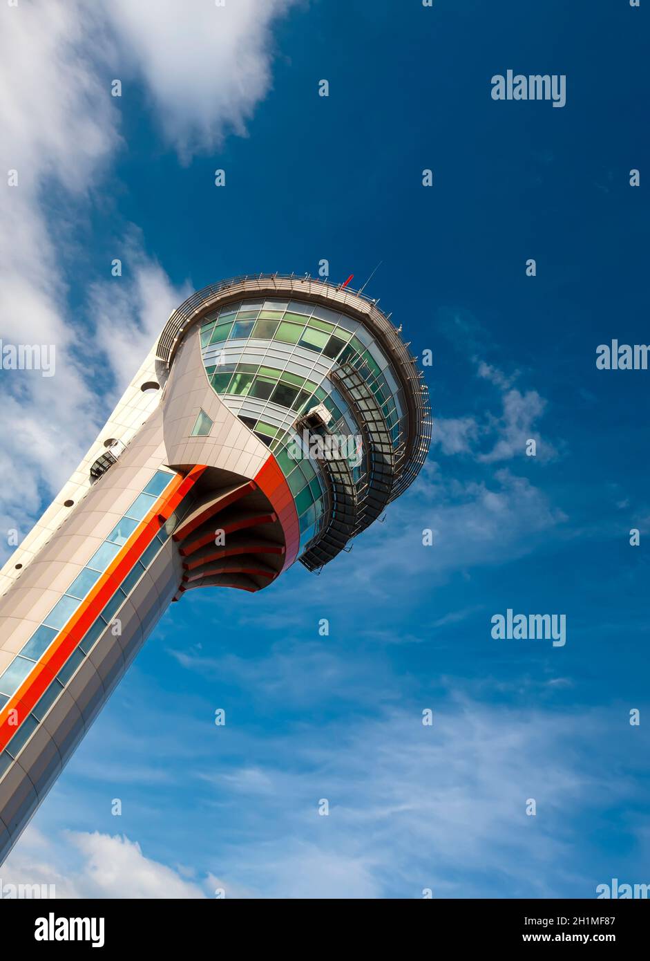 The tower in airport in Moscow. The tower against blue cloudy sky. Stock Photo