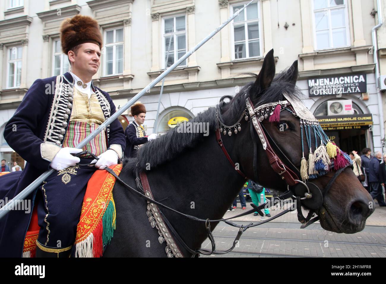 Parade of 70 participants, thirty horses and forty members of a brass band to the main square were announced next, 300th Sinjska alka in Zagreb Stock Photo