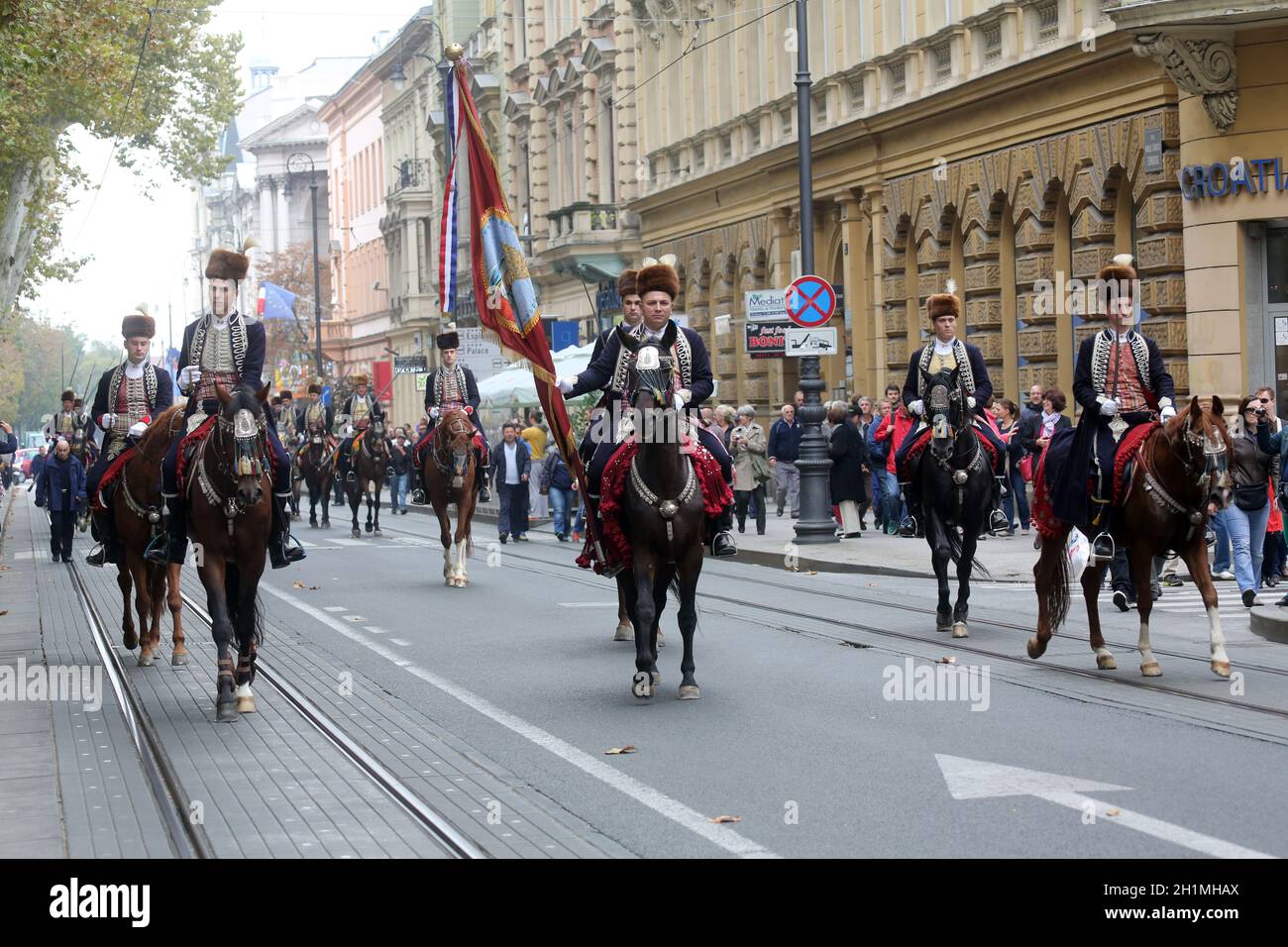 Parade of 70 participants, thirty horses and forty members of a brass band to the main square were announced next, 300th Sinjska Alka in Zagreb Stock Photo