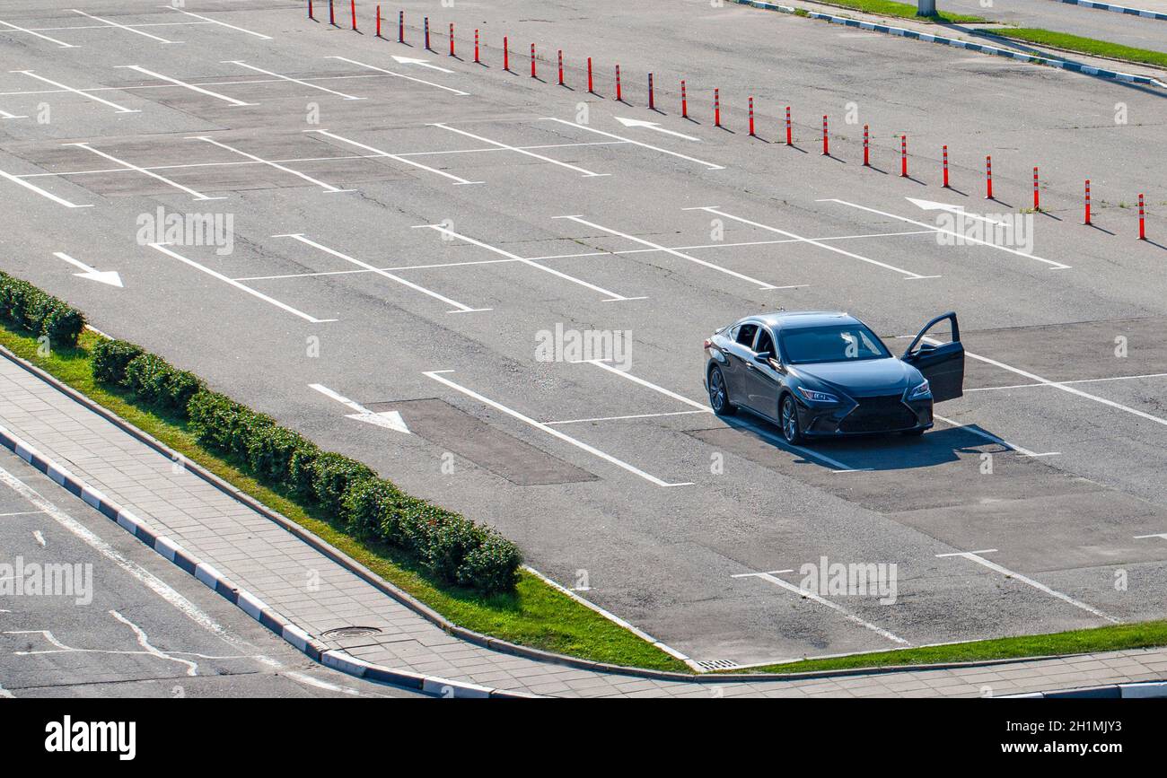 The one car with open door in the Parking lot Stock Photo