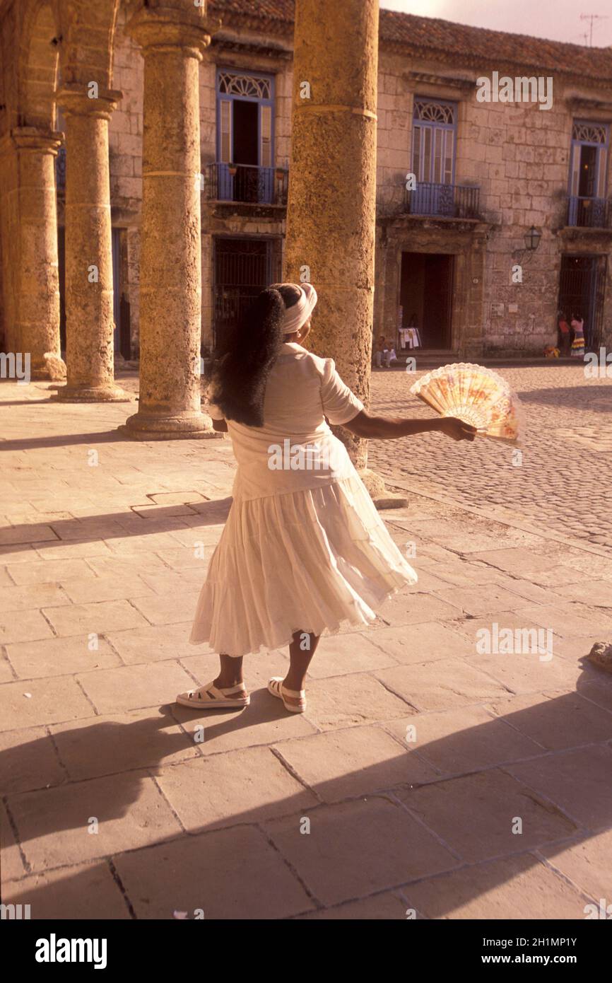 a cuba women in traditional dress in the city of Havana on Cuba in the caribbean sea.   Cuba, Havana, October, 2005 Stock Photo