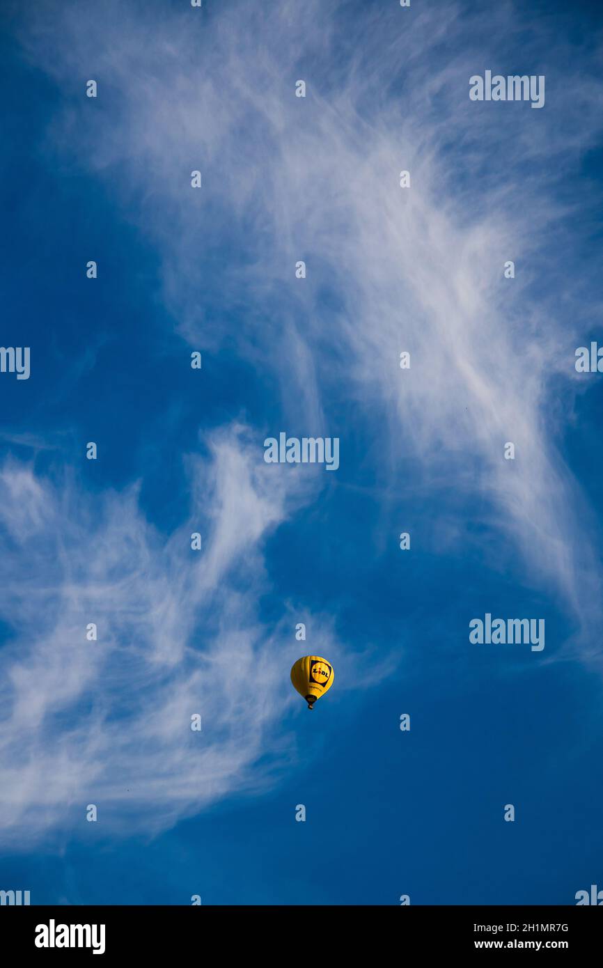 Beautiful view of a floating hot air balloon with a cloudy sky ...