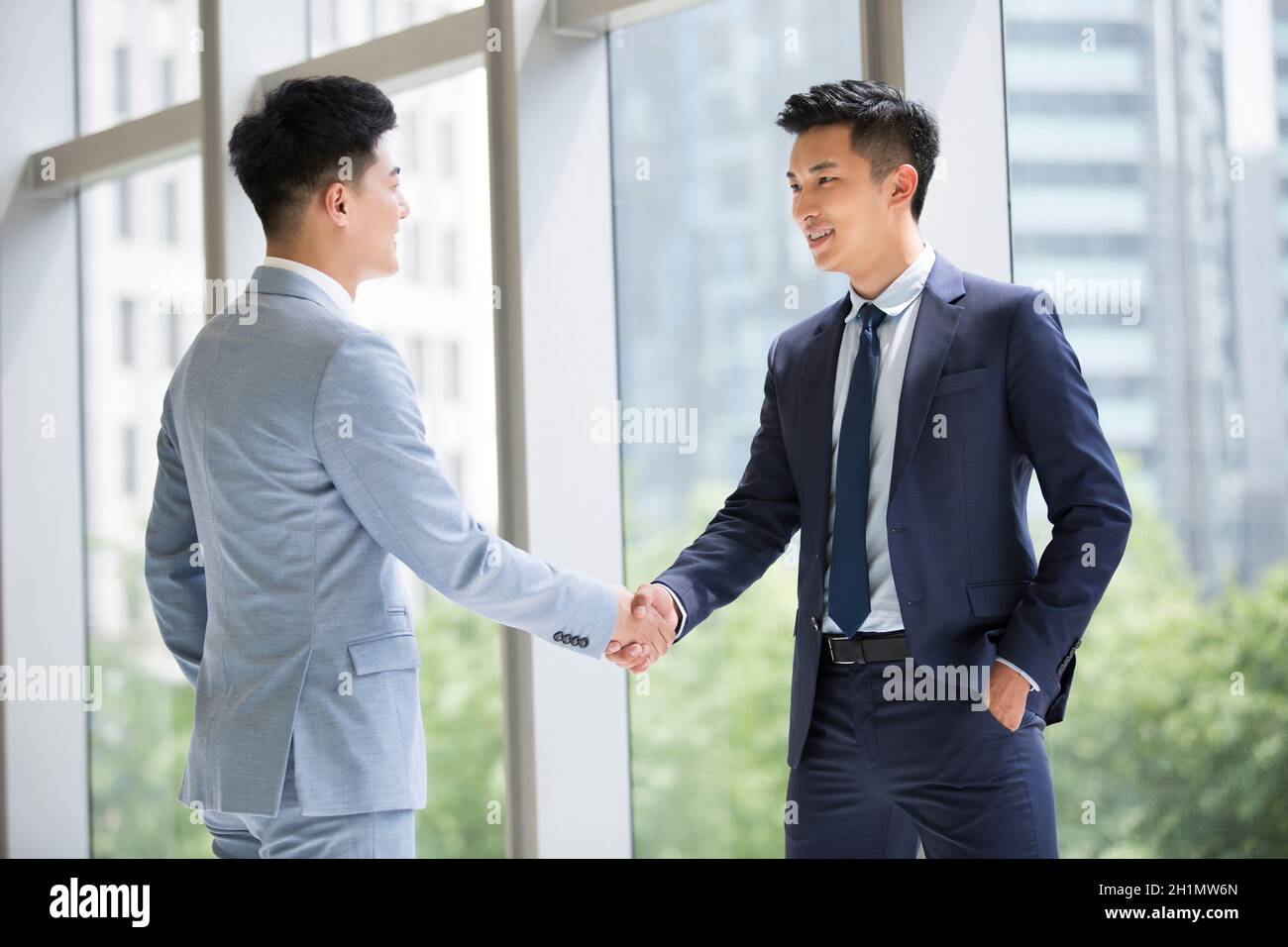 Businessmen shaking hands Stock Photo