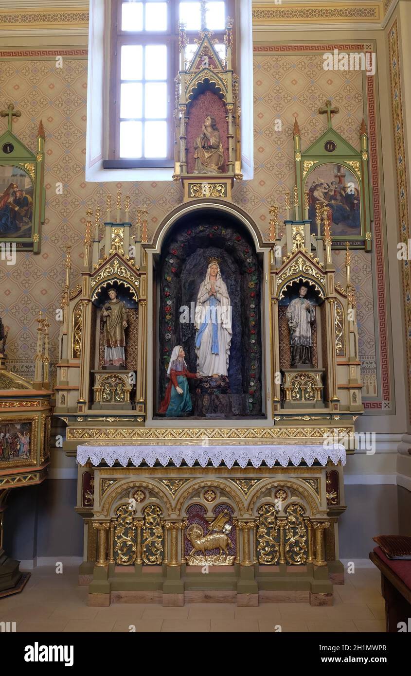 Altar of Our Lady of Lourdes in the church of Saint Matthew in Stitar, Croatia Stock Photo