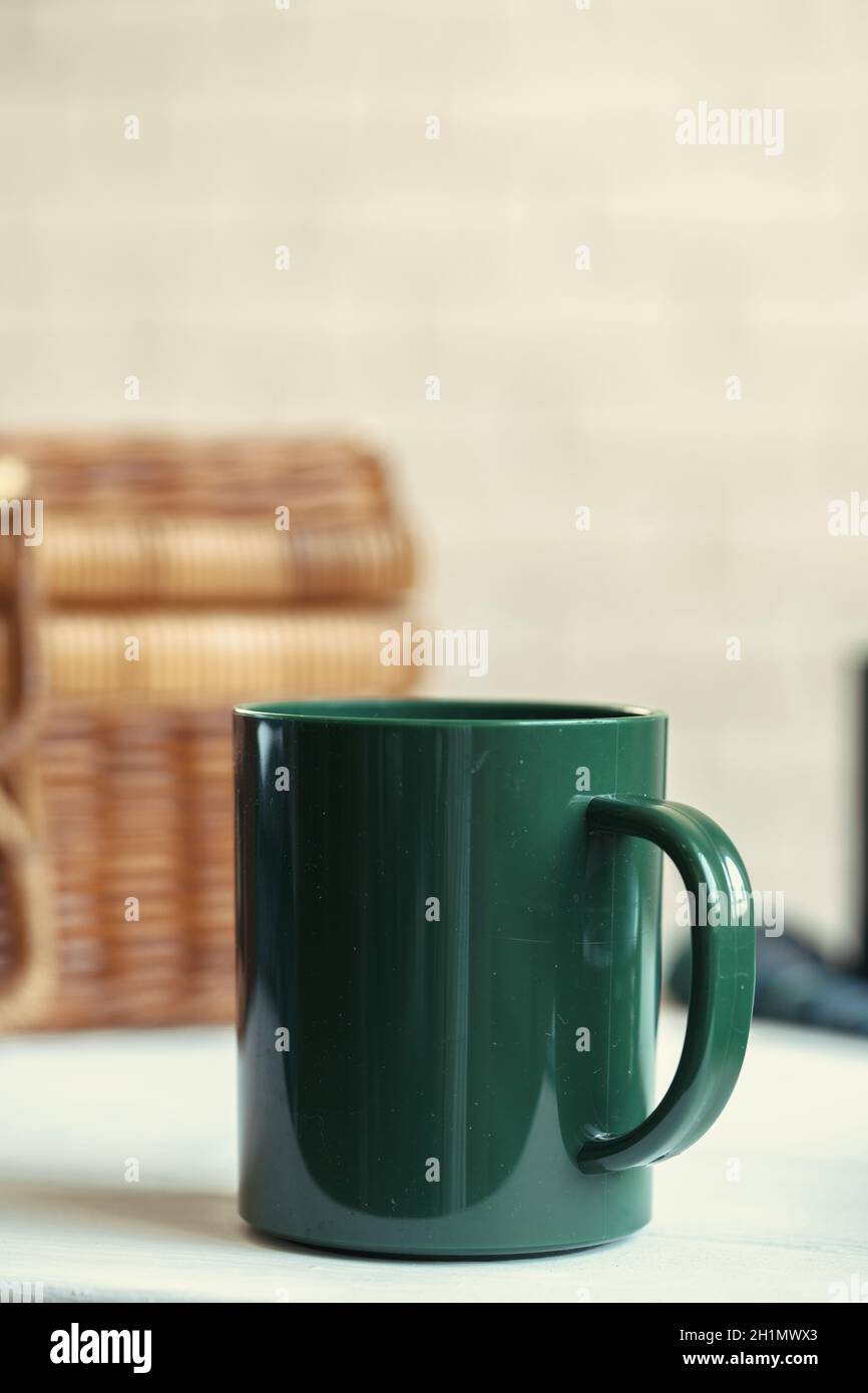 Green plastic kitchenware on a table close up Stock Photo