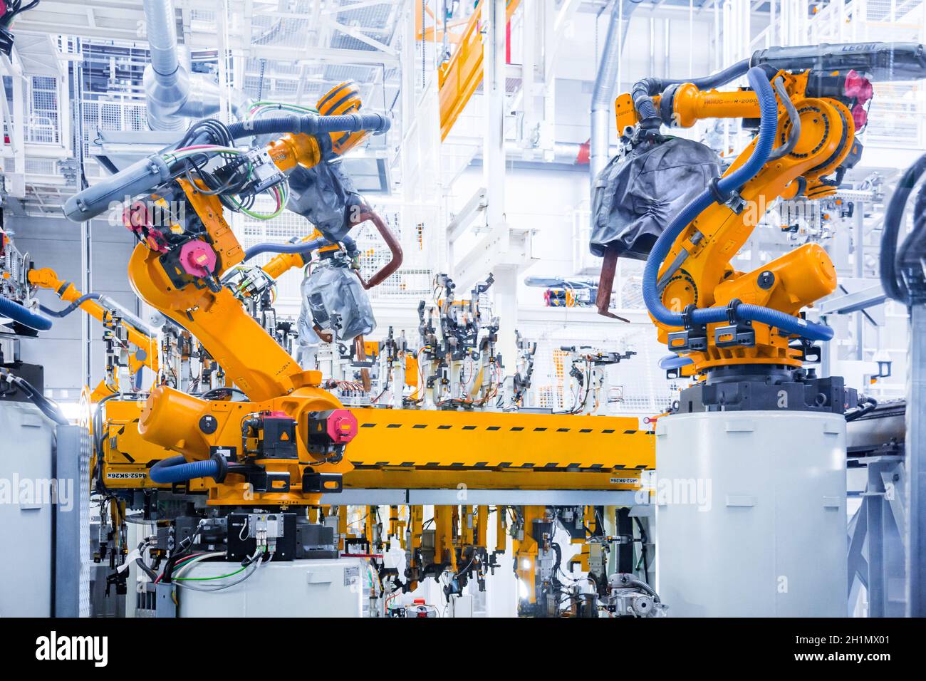 robotic arms in a car plant Stock Photo