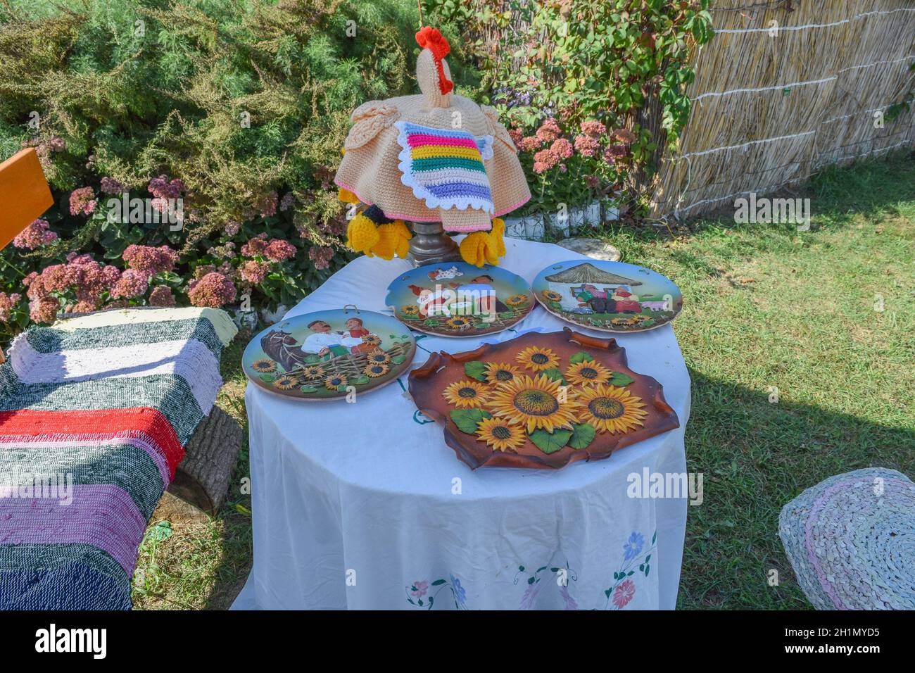 Painted plates on the table. Art painting on dishes Stock Photo - Alamy