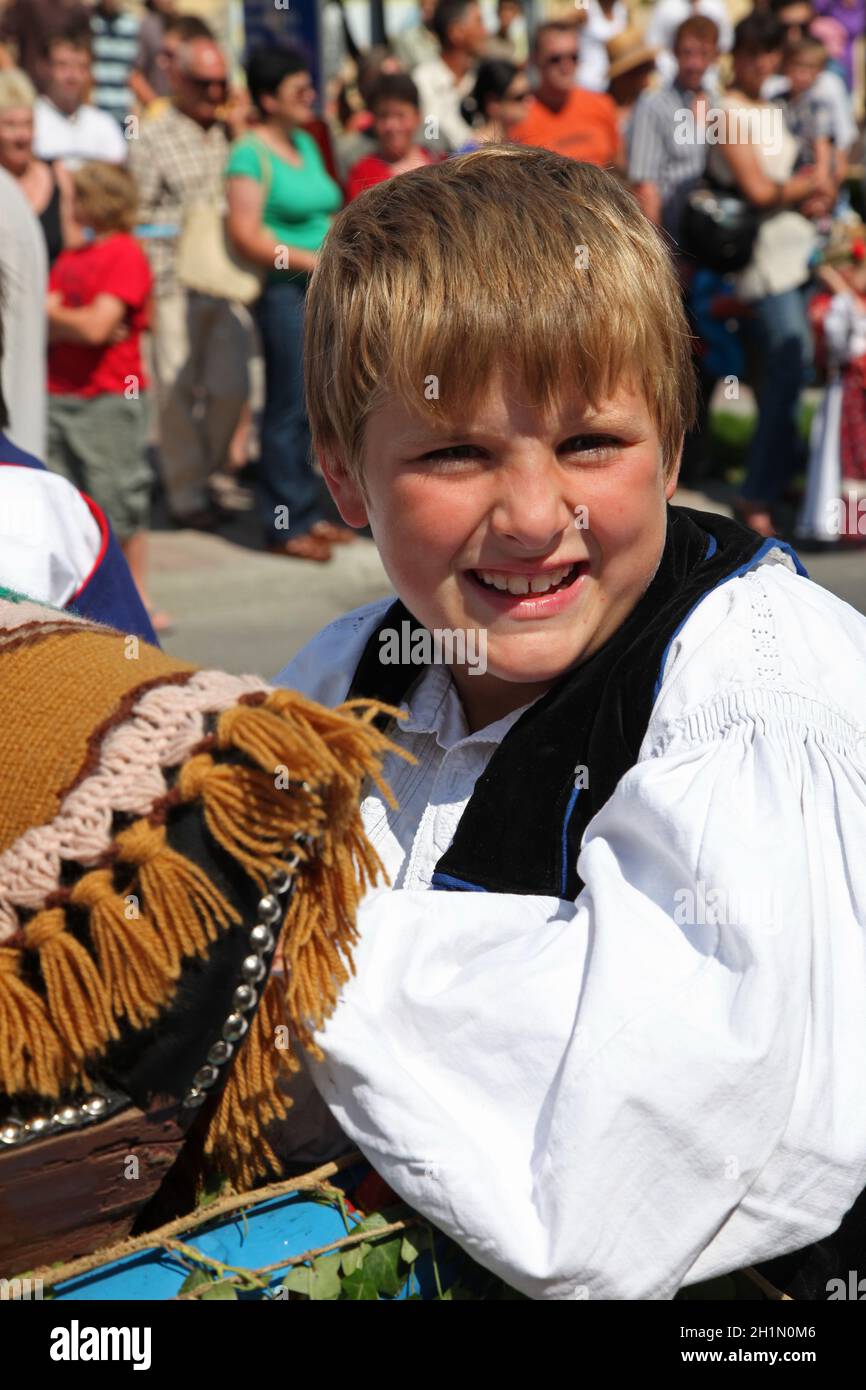 Participant in Croatian national costume, during the Dakovacki vezovi (Dakovo Summer Festival) in Dakovo, Croatia. Stock Photo