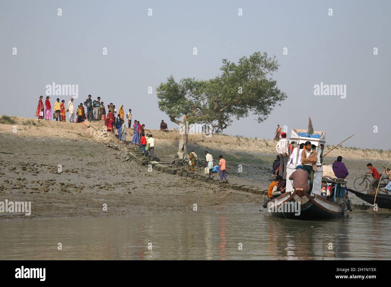 Wooden boat crosses river in Gosaba, West Bengal, India Stock Photo - Alamy