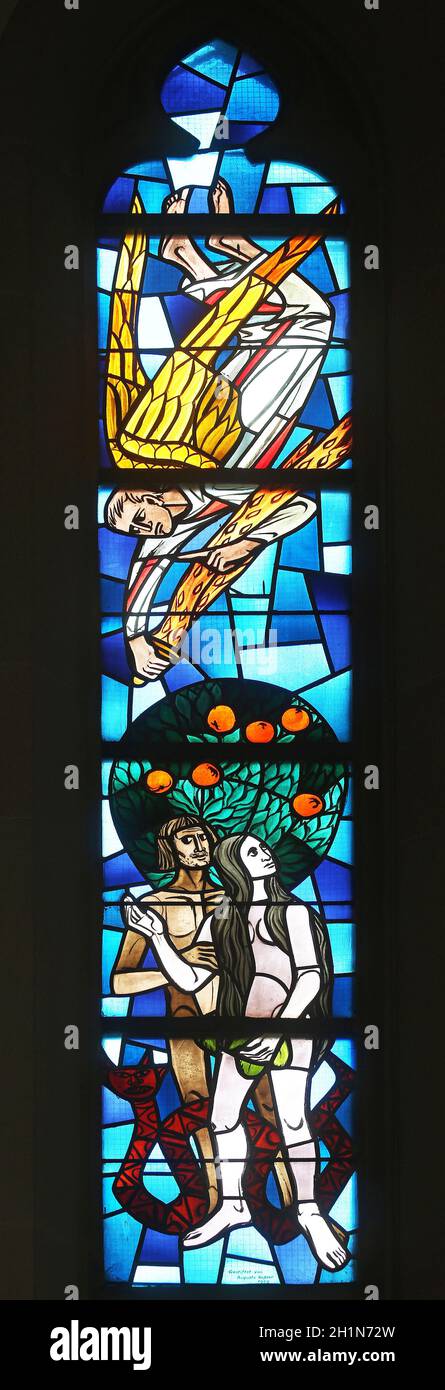 Adam and Eve, stained glass window at Evangelical Church in Wasseralfingen, Germany Stock Photo