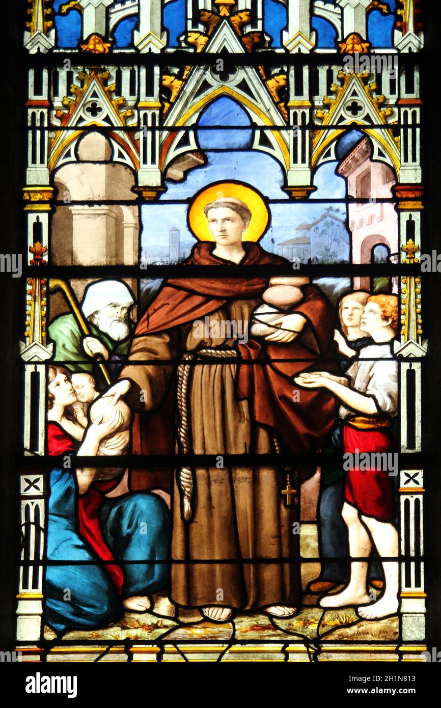 Saint Anthony distributes bread, stained glass, Saint Severin church, Paris, France Stock Photo