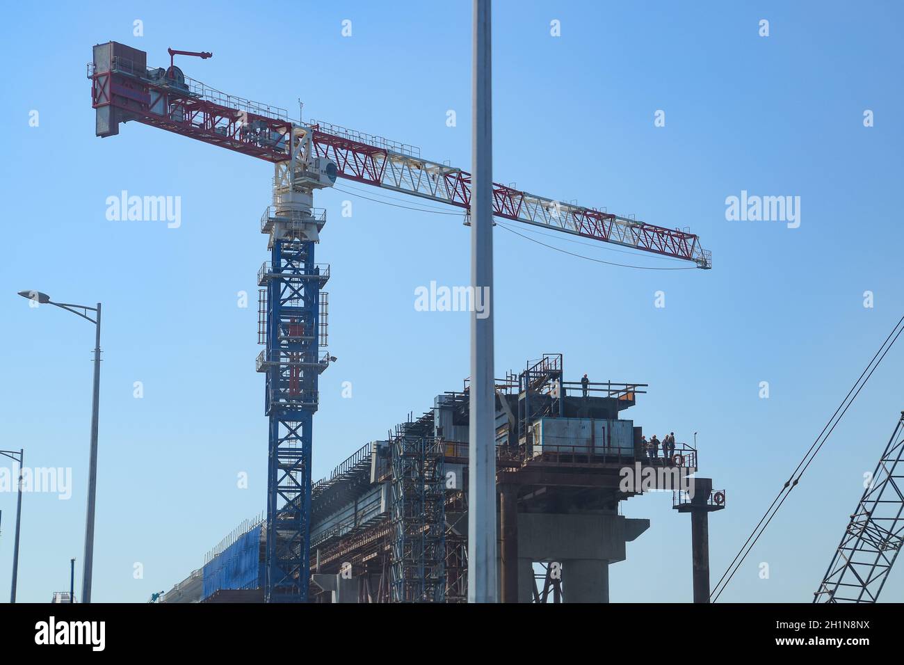 Crimean bridge, Taman, Russia - July 9, 2018: Construction of the Crimean bridge. Lift cranes and railway bridge elements. Construction and repair. Dr Stock Photo