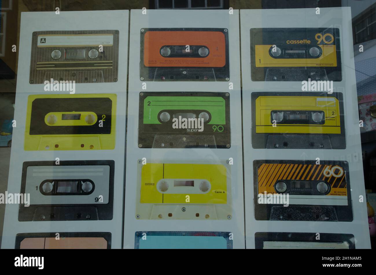 Images of cassette tapes on a poster in the shop window. San Cristobal