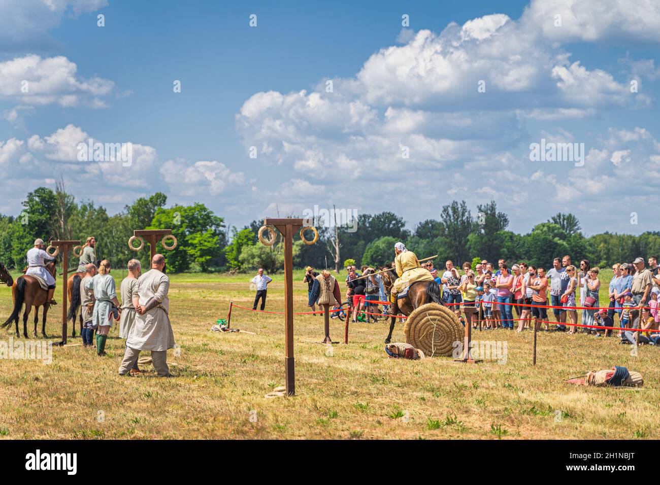 Cedynia, Poland June 2019 Warrior with javelin attacking dummy, horseback riding show on historical reenactment of Battle of Cedynia from 11th century Stock Photo