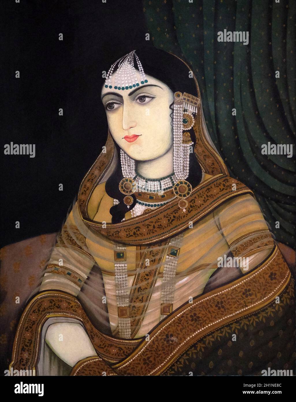 Portraits of historical indian people on wall of Park Regis Hotel in
