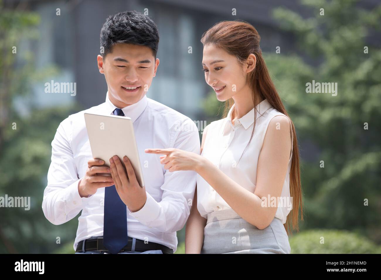 Confident businessmen using a tablet computer Stock Photo
