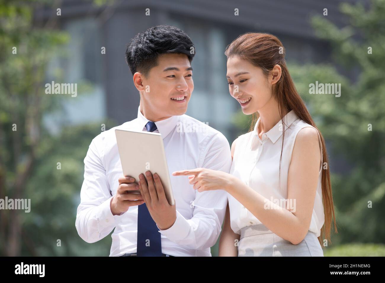 Confident businessmen using a tablet computer Stock Photo