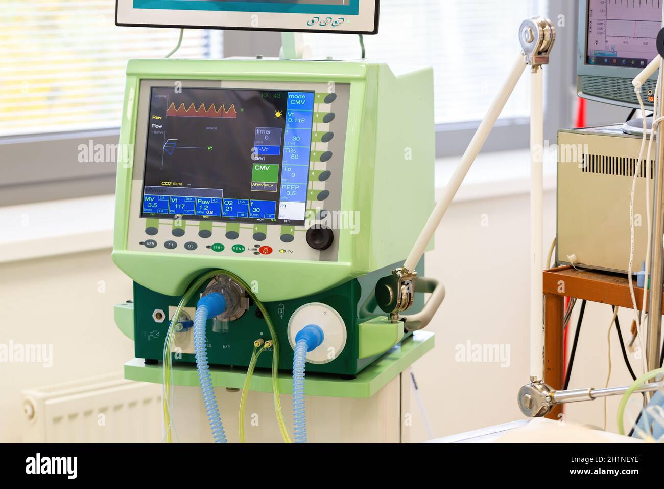 Monitor of pulmonary ventilator in hospital with tubes for air. Display