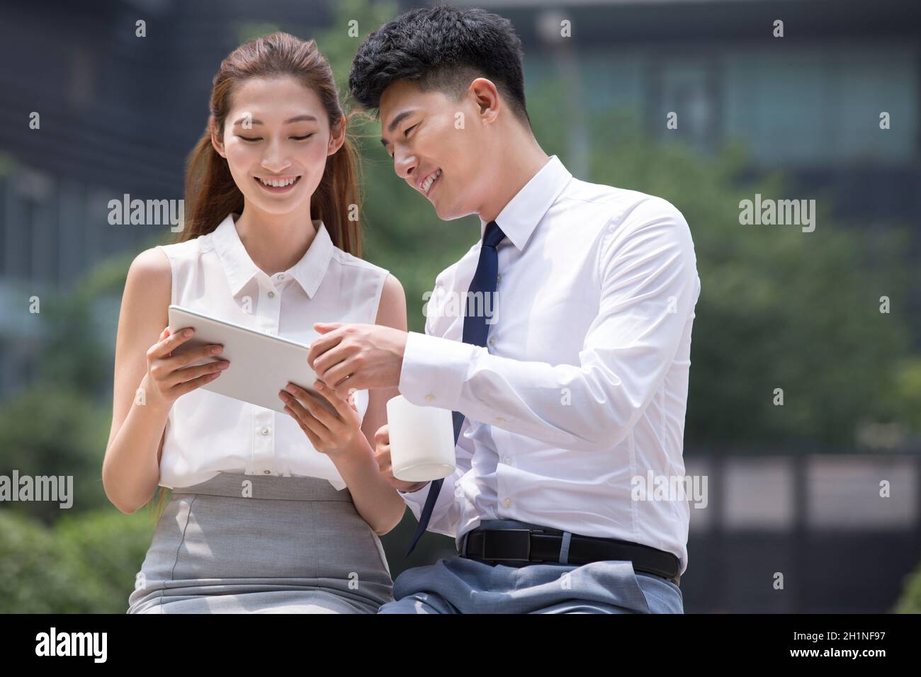 Confident businessmen using a tablet computer Stock Photo